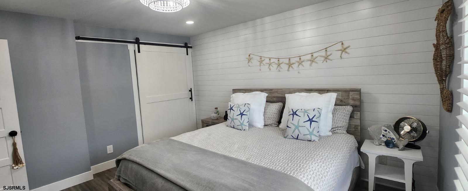 504 East Brigantine Avenue, Unit 504 Brigantine, NJ 08203 - Photo 39 of 43 a bedroom with a bed and a table in it