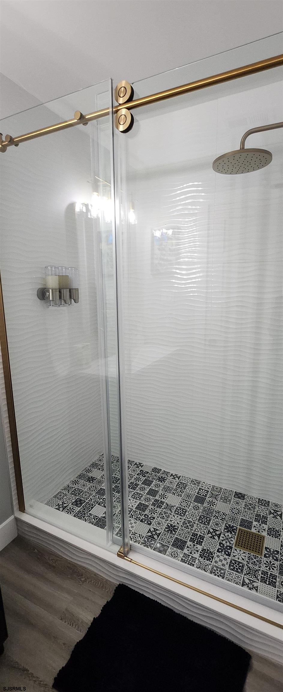 504 East Brigantine Avenue, Unit 504 Brigantine, NJ 08203 - Photo 42 of 43 a bathroom with a window and a shower