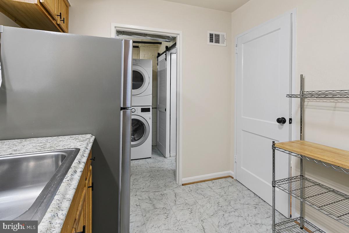 9003 Manchester Road, Unit 9003 Silver Spring, MD 20901 - Photo 12 of 53 a view of a kitchen with a sink