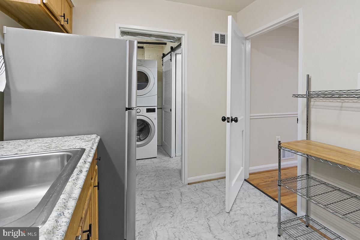 9003 Manchester Road, Unit 9003 Silver Spring, MD 20901 - Photo 13 of 53 a bathroom with a sink and mirror