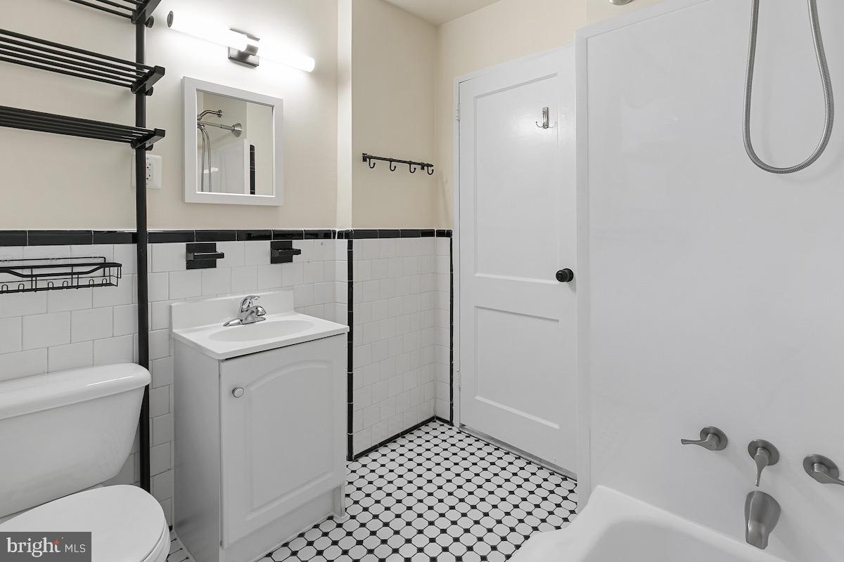 9003 Manchester Road, Unit 9003 Silver Spring, MD 20901 - Photo 31 of 53 a bathroom with a sink toilet and shower