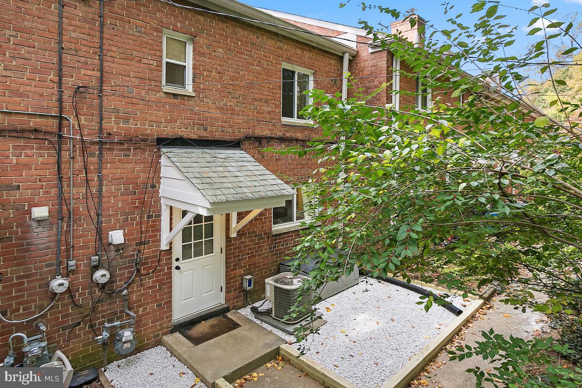 9003 Manchester Road, Unit 9003 Silver Spring, MD 20901 - Photo 48 of 53 front view of a house with a small yard