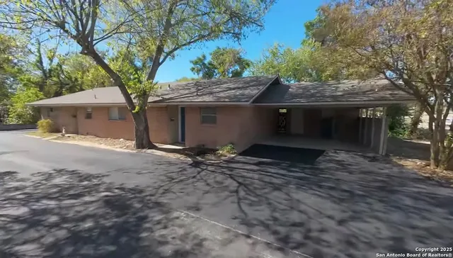 a house with trees in front of it