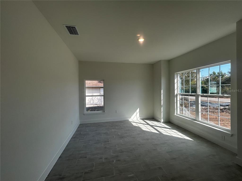 498 Santiguay Street Punta Gorda, FL 33983 - Photo 2 of 28 a view of an empty room with a window