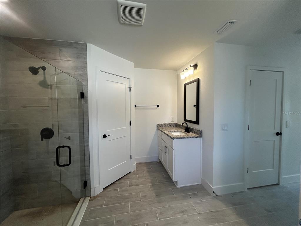 498 Santiguay Street Punta Gorda, FL 33983 - Photo 10 of 28 a view of a bathroom with a sink and mirror
