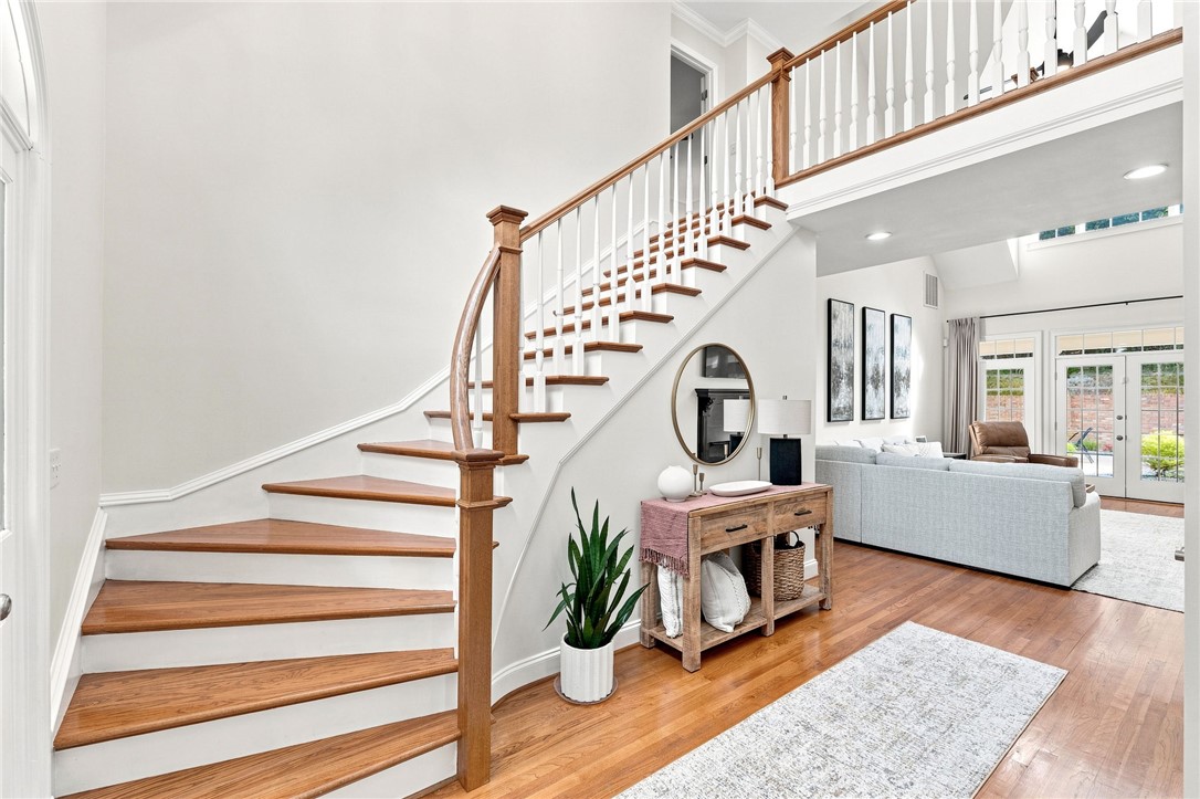 320 Watson Road Easley, SC 29642 - Photo 25 of 50 An elegant curved staircase anchors the welcoming entryway leading into an open-concept living space.
