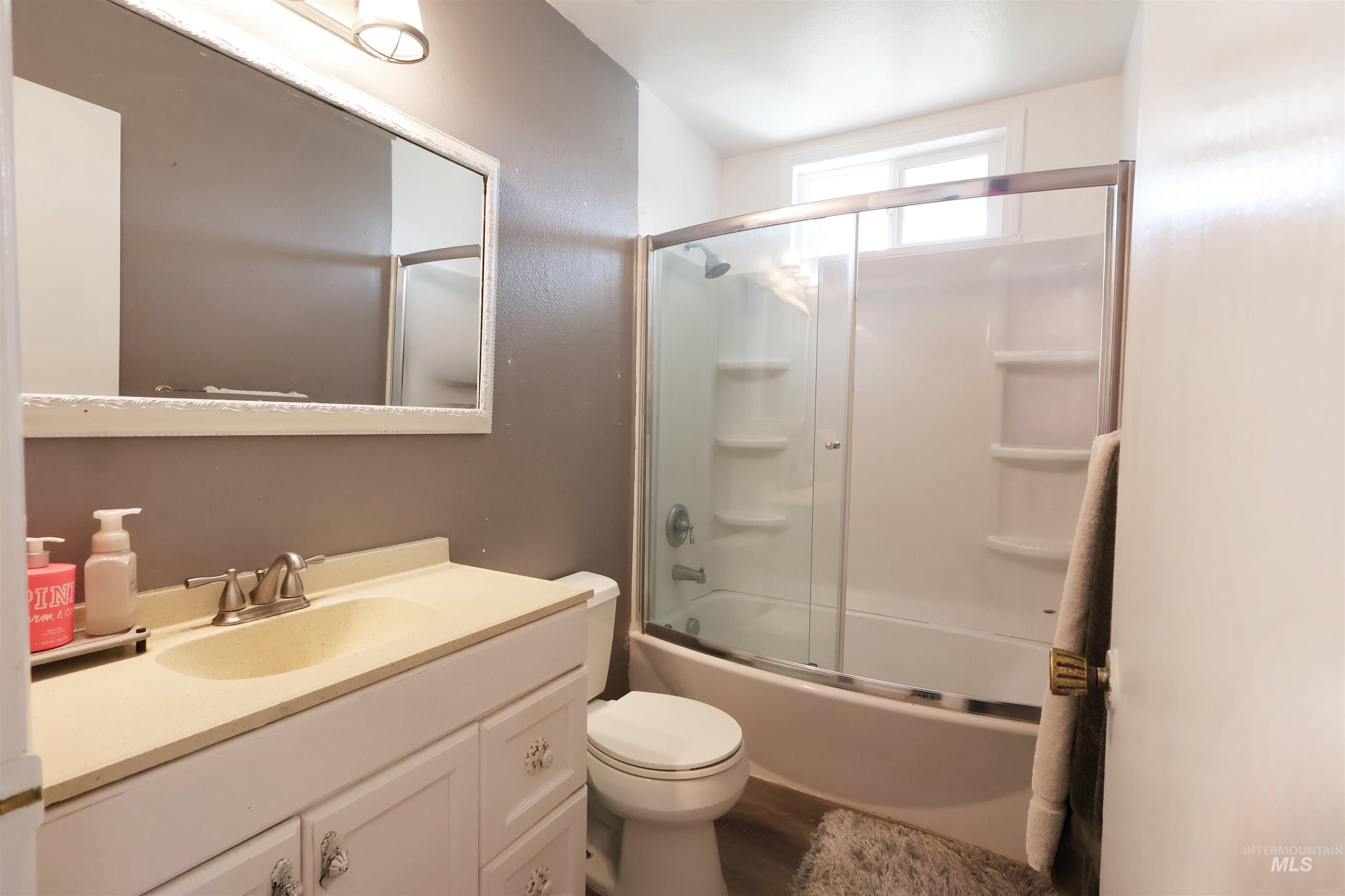 412 Linden Street Rupert, ID 83350 - Photo 11 of 17 Full bath featuring vanity and combined bath / shower with glass door