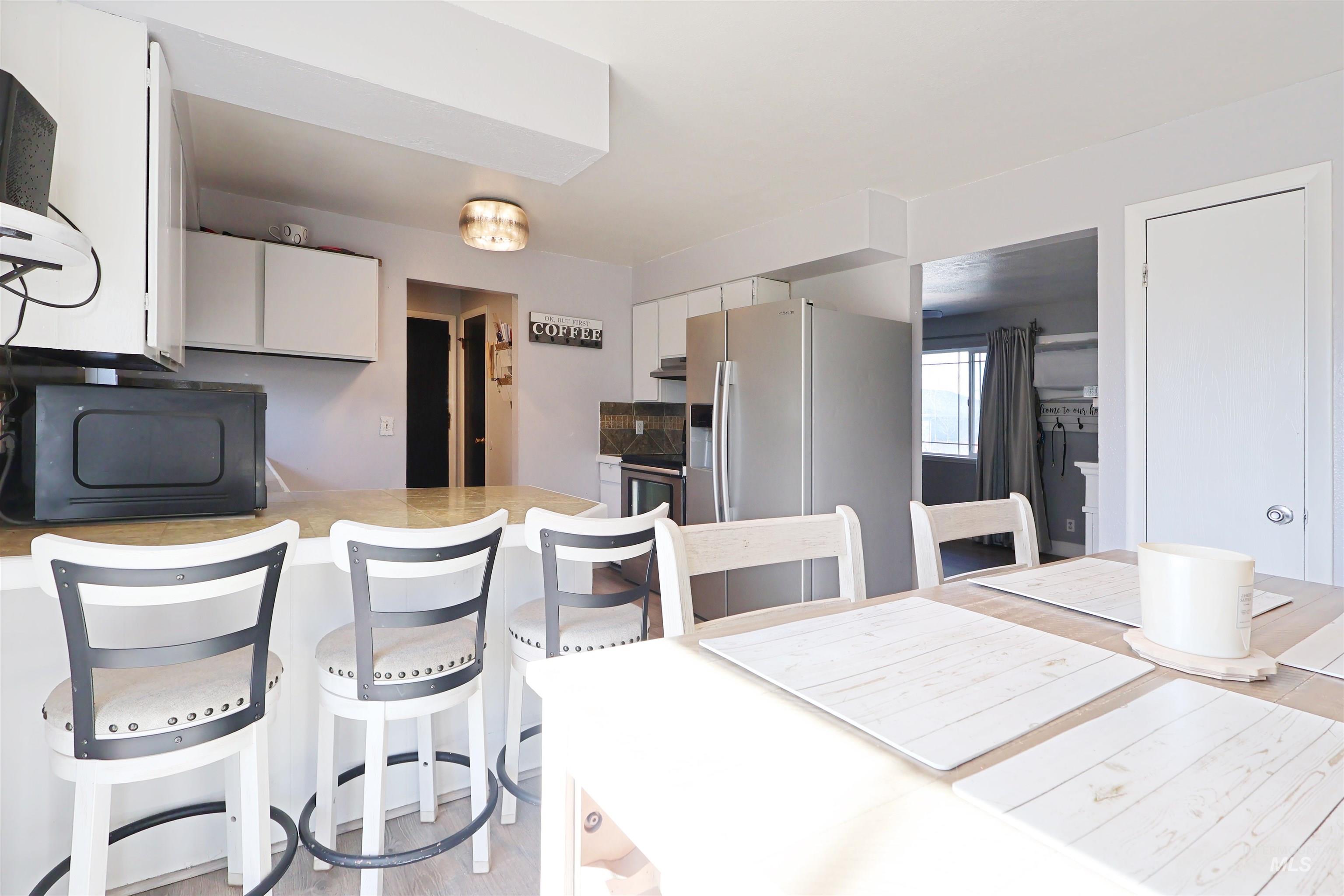 412 Linden Street Rupert, ID 83350 - Photo 6 of 17 Dining area with light wood-style flooring