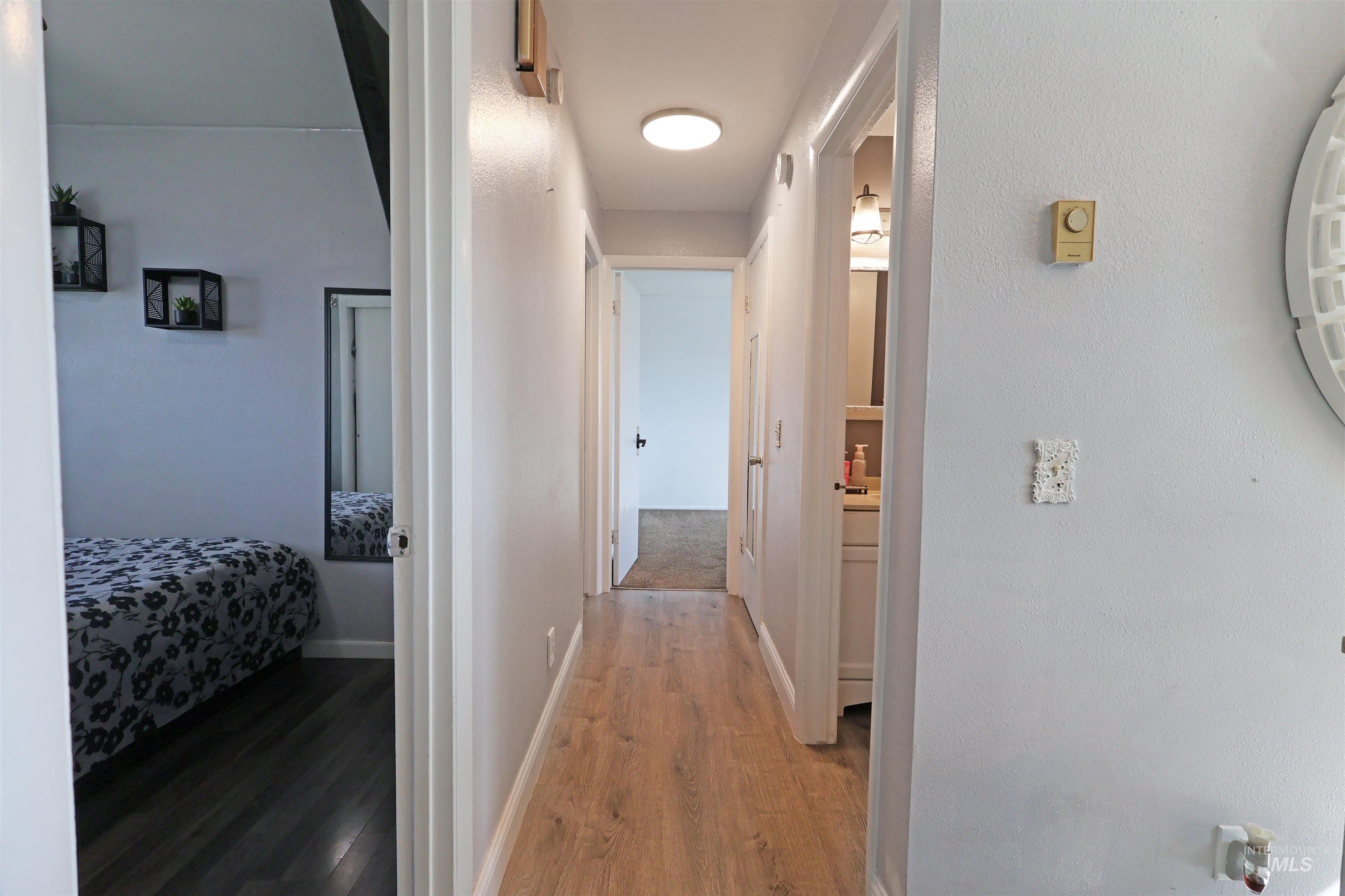 412 Linden Street Rupert, ID 83350 - Photo 9 of 17 Hall with light wood-style floors and baseboards