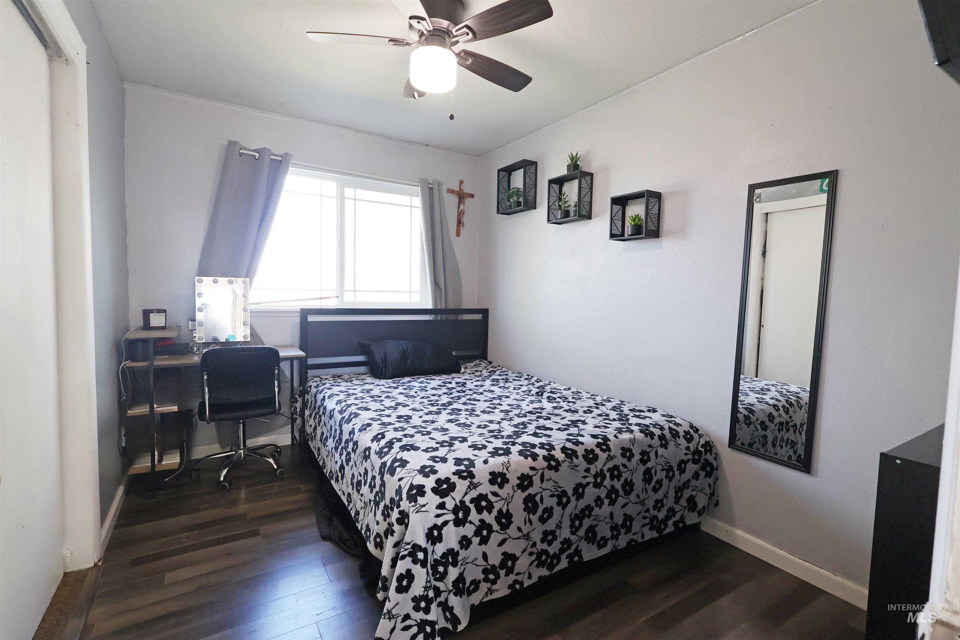 412 Linden Street Rupert, ID 83350 - Photo 10 of 17 Bedroom with dark wood-style flooring, a ceiling fan, and an office area