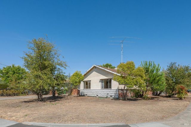 a house with a tree in front of it