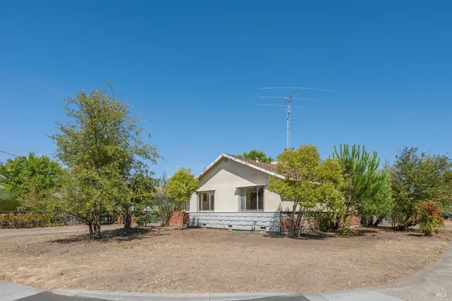 a house with a tree in front of it