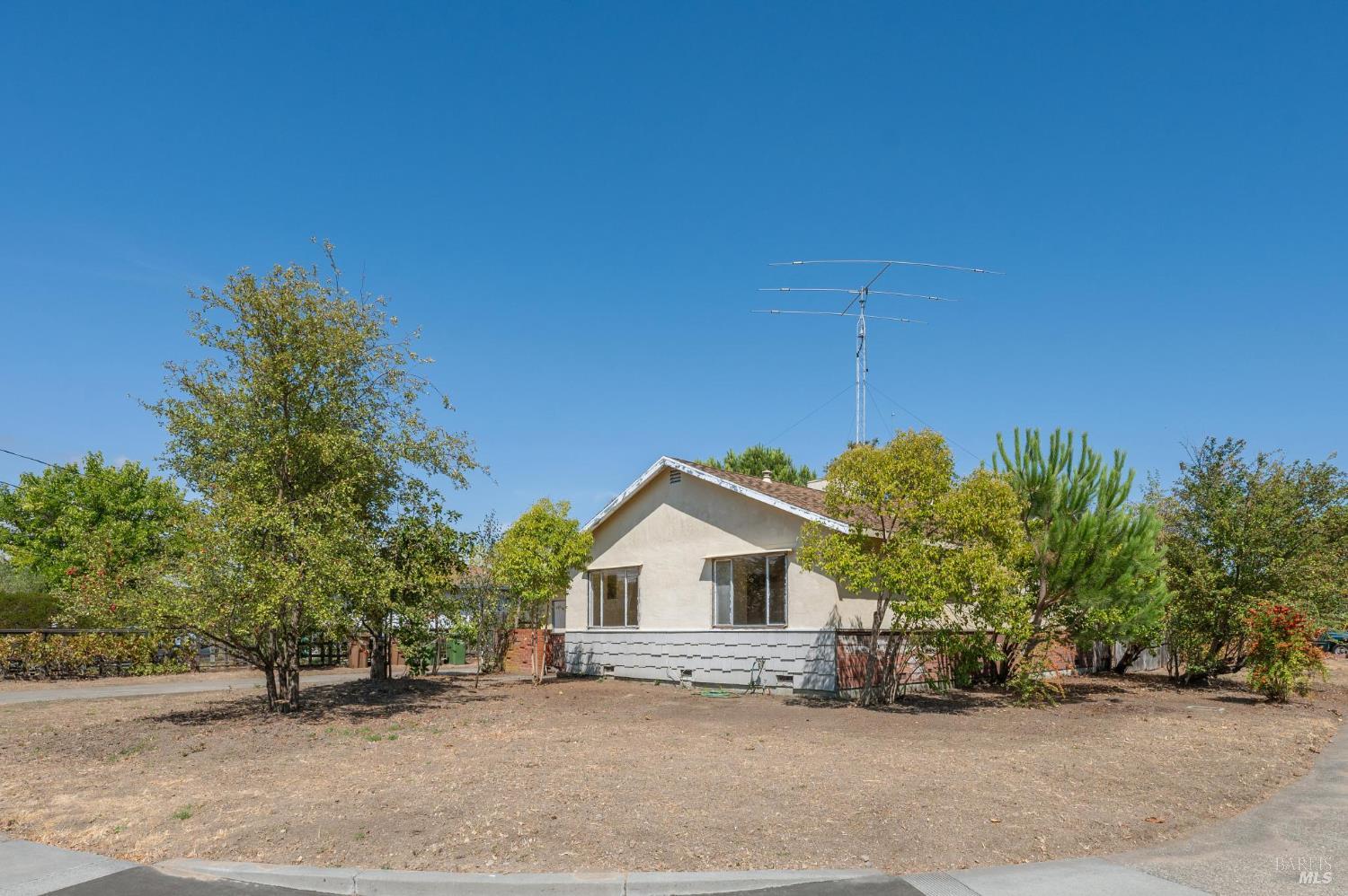 a house with a tree in front of it