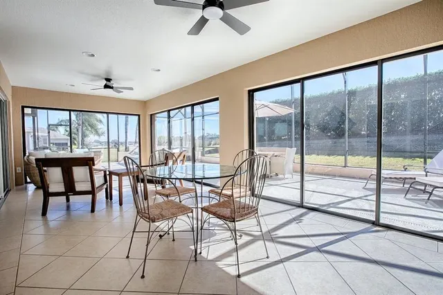 a view of a kitchen with a dining table and chairs