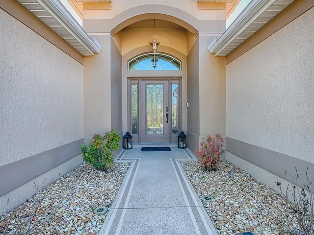 a view of a dining room with furniture and a large window
