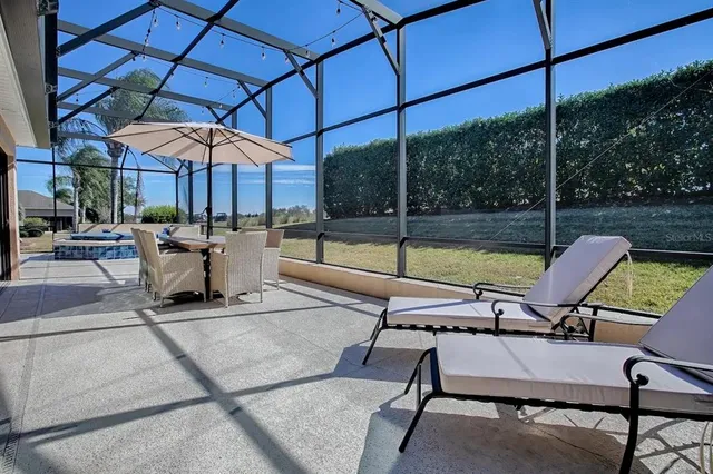 a spacious bathroom with a granite countertop sink a mirror and a shower