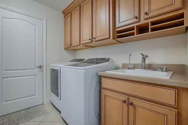 an aerial view of a house with a yard and fountain