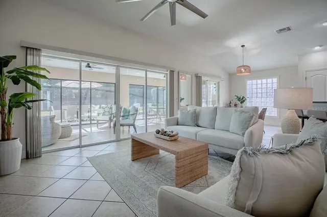 a kitchen with cabinets and chairs