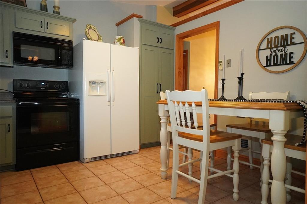 2701 College Park Road Allison Park, PA 15101 - Photo 11 of 29 a kitchen with a refrigerator and a stove top oven