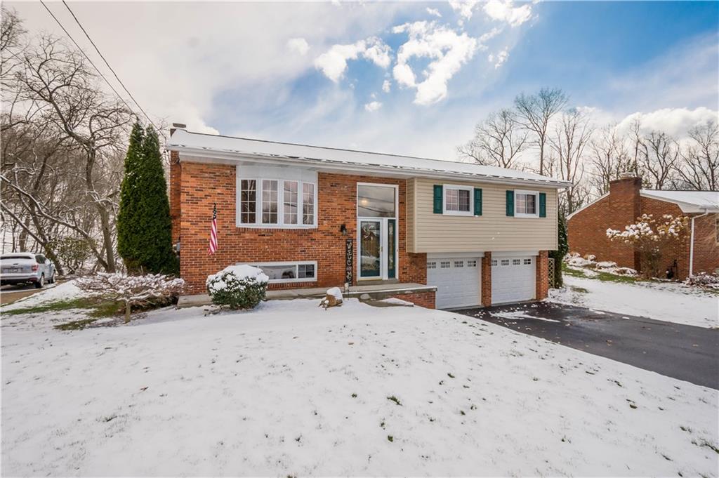 2701 College Park Road Allison Park, PA 15101 - Photo 29 of 29 a front view of a house with a yard and garage