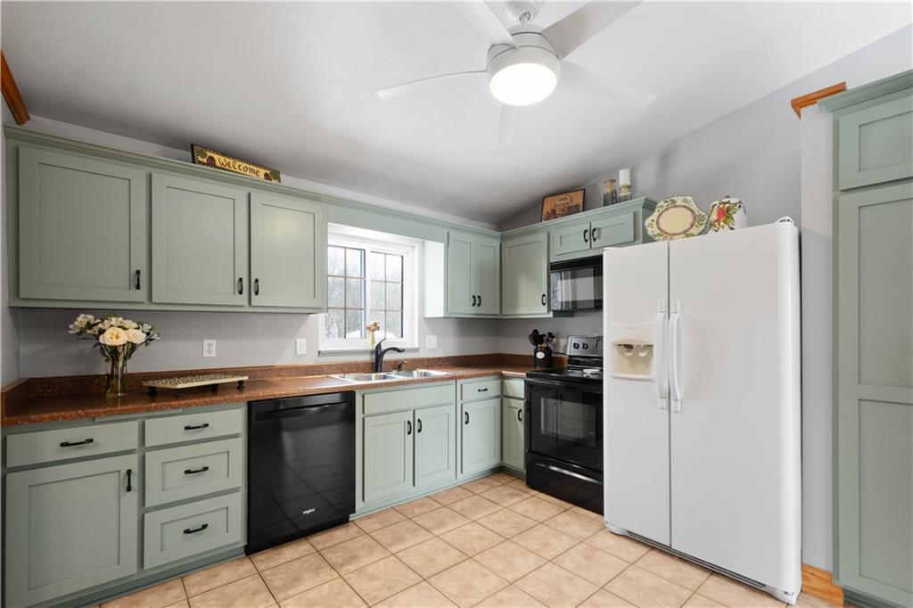2701 College Park Road Allison Park, PA 15101 - Photo 8 of 29 a kitchen with a sink a refrigerator and cabinets