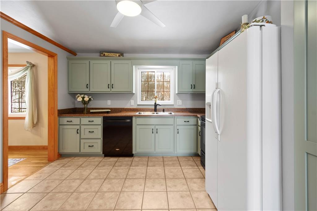 2701 College Park Road Allison Park, PA 15101 - Photo 9 of 29 a kitchen with a sink a stove a refrigerator and cabinets