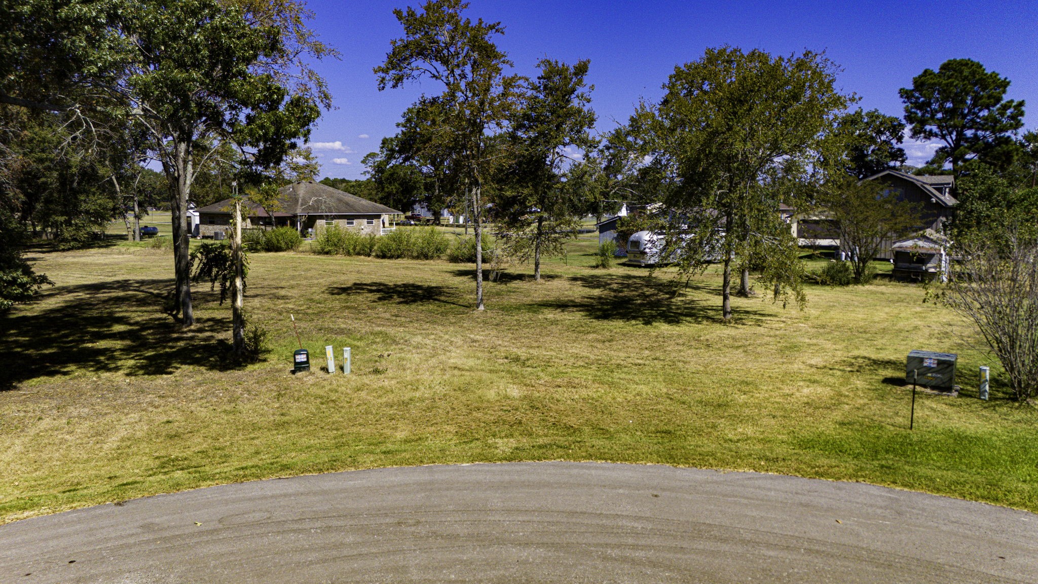 132 Legacy Boulevard Point Blank, TX 77364 - Photo 6 of 11 a view of a yard with a tree