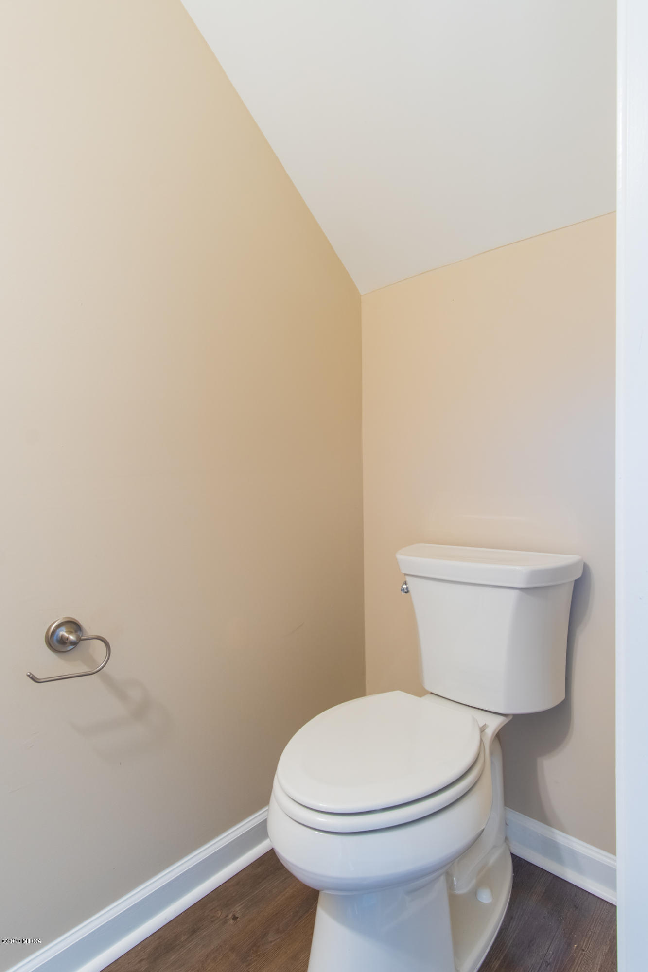 321 Pond View Road Macon, GA 31206 - Photo 8 of 22 a white toilet sitting next to a white wall