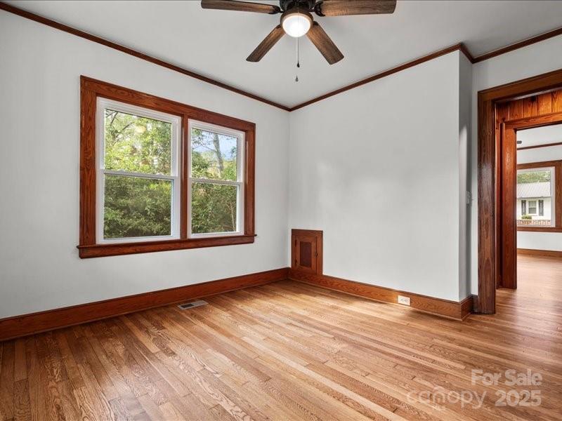 37 Lynn Avenue Cheraw, SC 29520 - Photo 12 of 30 a view of an empty room with wooden floor and a window