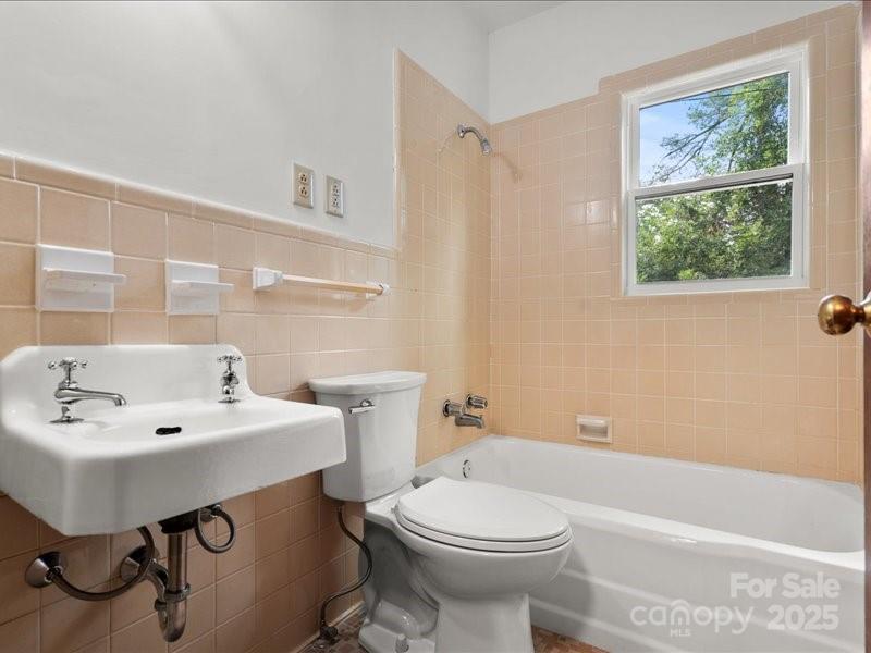 37 Lynn Avenue Cheraw, SC 29520 - Photo 13 of 30 a bathroom with a sink a toilet and a mirror