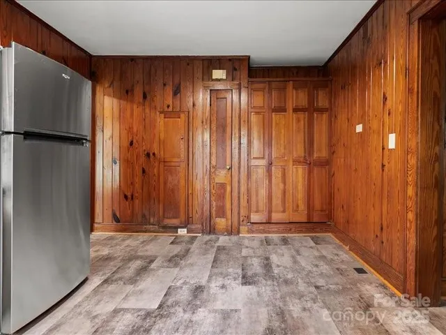 a view of entryway with wooden walls