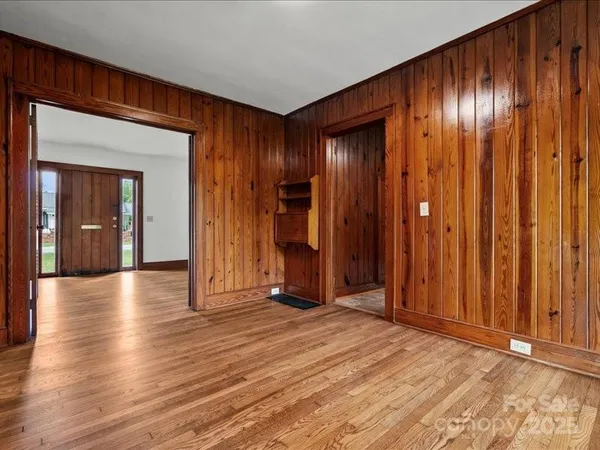 a view of hallway with wooden floor