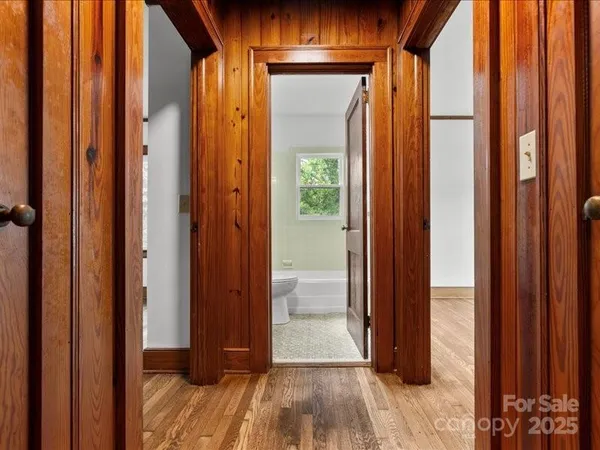 a view of front door with wooden floor