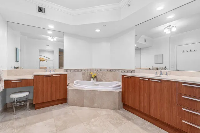 a bedroom with a bed a couch and a window