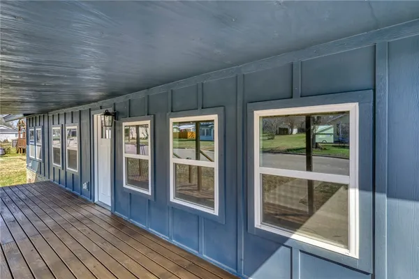 a view of hallway with wooden floor