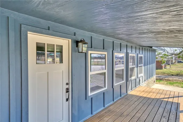 a view of kitchen with cabinets and wooden floor
