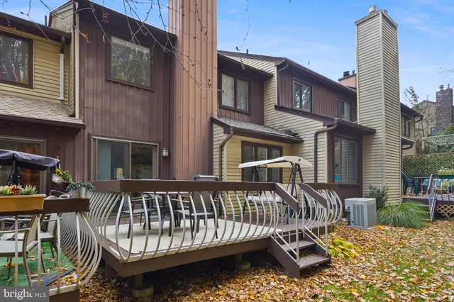 a view of a house with a wooden deck