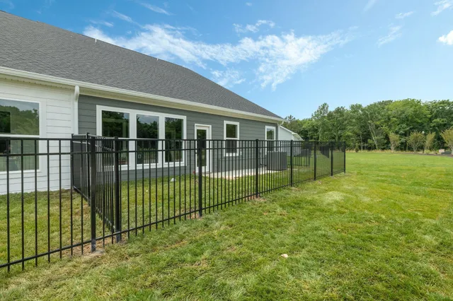 a view of a backyard with sitting area