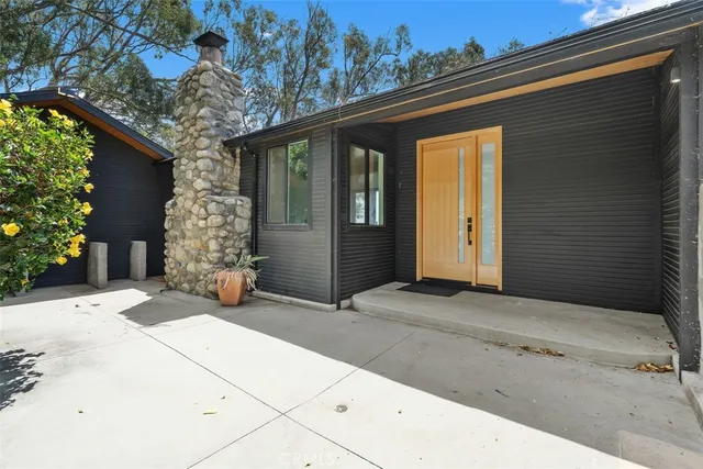 a backyard of a house with outdoor seating