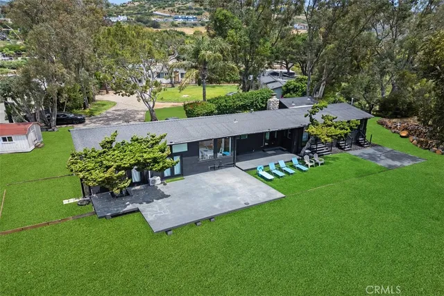 a living room with a couch and a painting on the wall