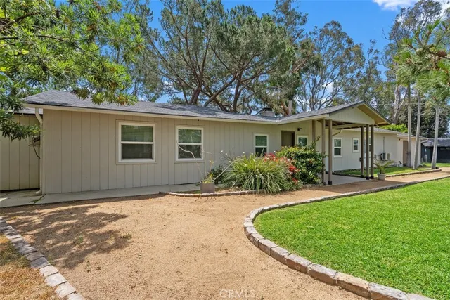 a view of a room with wooden floor and windows