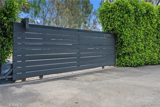 a view of a backyard with a tree