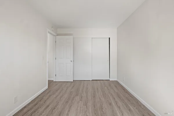 a kitchen with stainless steel appliances granite countertop a refrigerator a stove a sink and a refrigerator