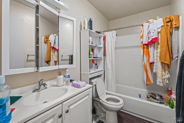 a bedroom with bed and window