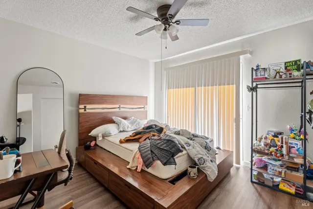 a bed room with a bed and a desk