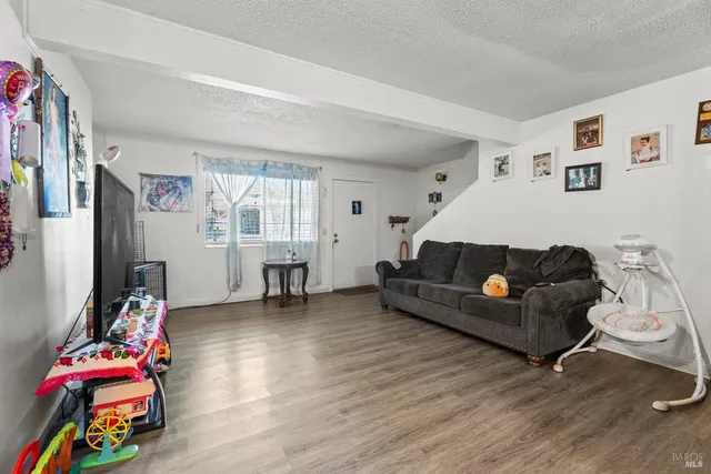 a dining room with furniture and chandelier