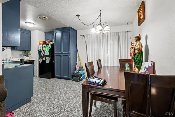 a kitchen with stainless steel appliances granite countertop a refrigerator stove and sink