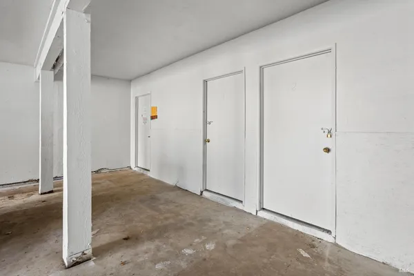 a view of a room with wooden floor