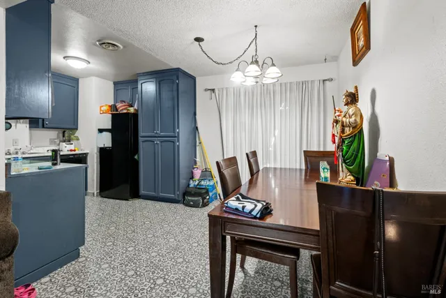 a kitchen with stainless steel appliances granite countertop a refrigerator stove and sink