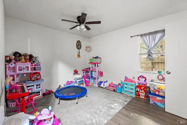 a bathroom with a sink a toilet and shower curtain